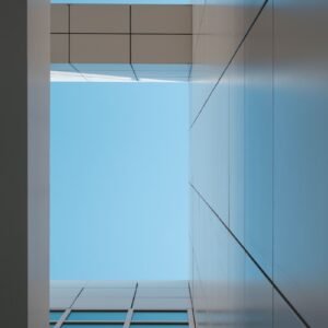 a tall building with a blue sky in the background